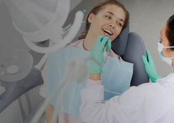 Dentist cleaning a patient's teeth