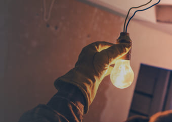 Two engineers working on a electrical panel