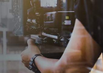 Videographer holding a video camera