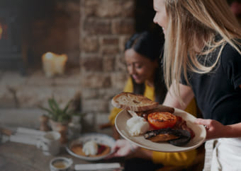 Waitress serving a meal to a customer