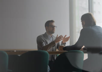 Two bisnessmen discussing in a conference room