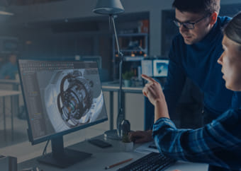 Two engineers examining 3D models in a computer