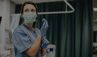 Nurse putting gloves on