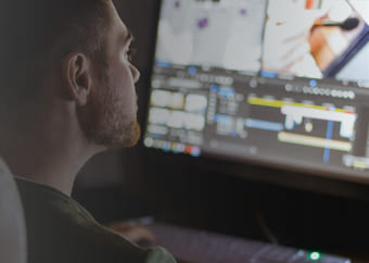 Man editing a video on a computer