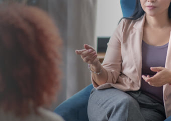 Psychologist talking to a patient