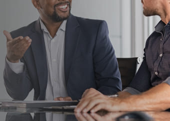 Two bisnessmen discussing in a conference room