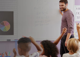 Teacher in front of class of children