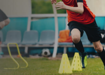 Soccer player practicing in the field