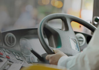 Bus driver driving a bus