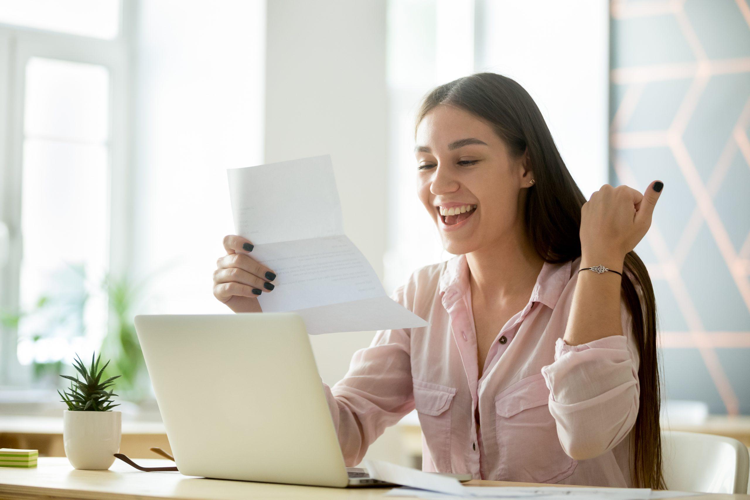 female job seeker excited accepting job offer letter